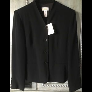Collarless black jacket with V-neck and 5 black buttons for closure.